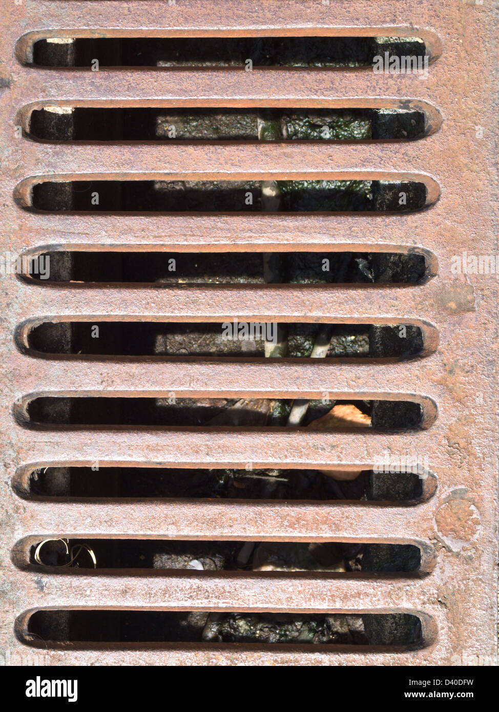 Rusty metal grate drain as background Stock Photo