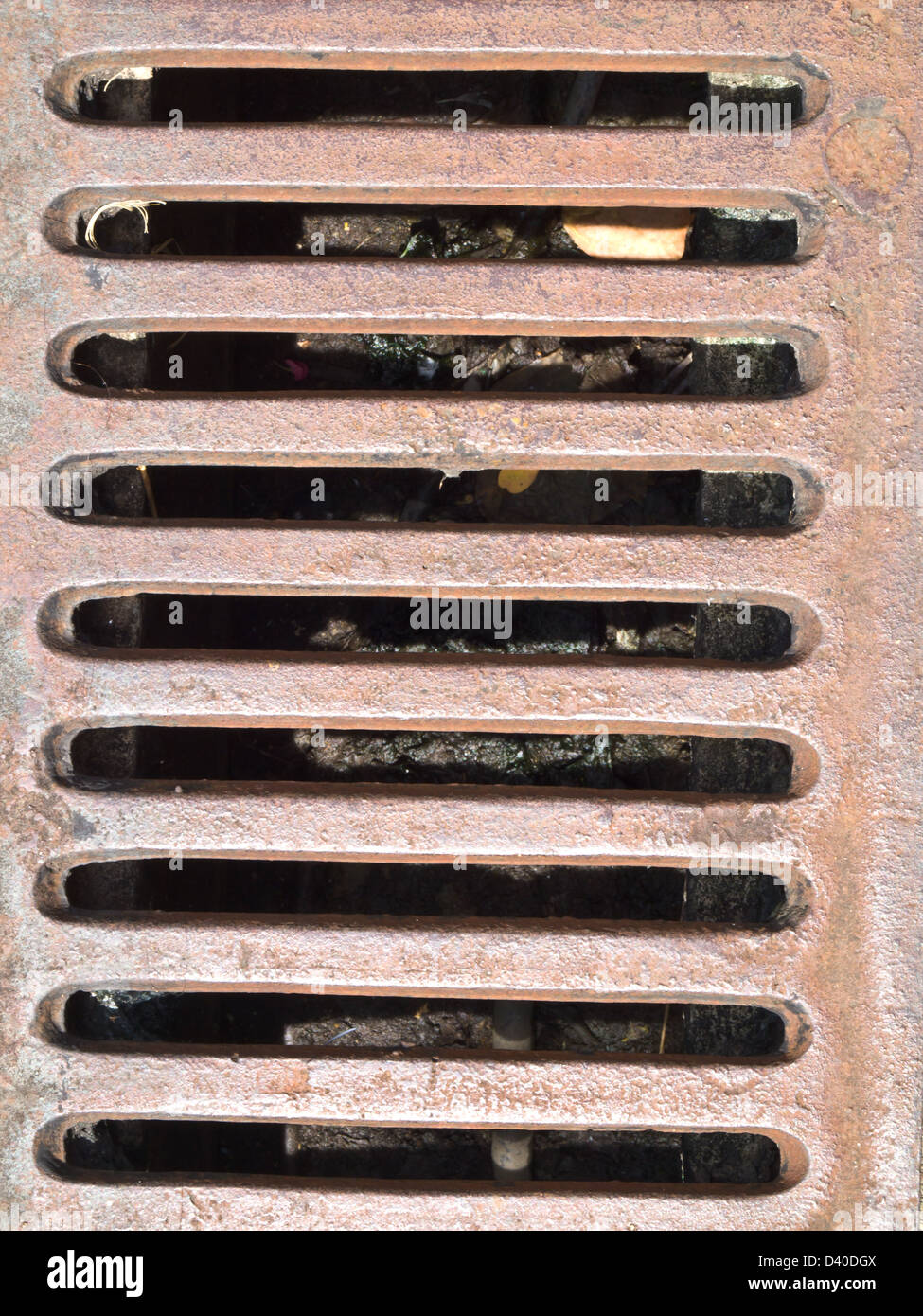 Rusty metal grate drain as background Stock Photo