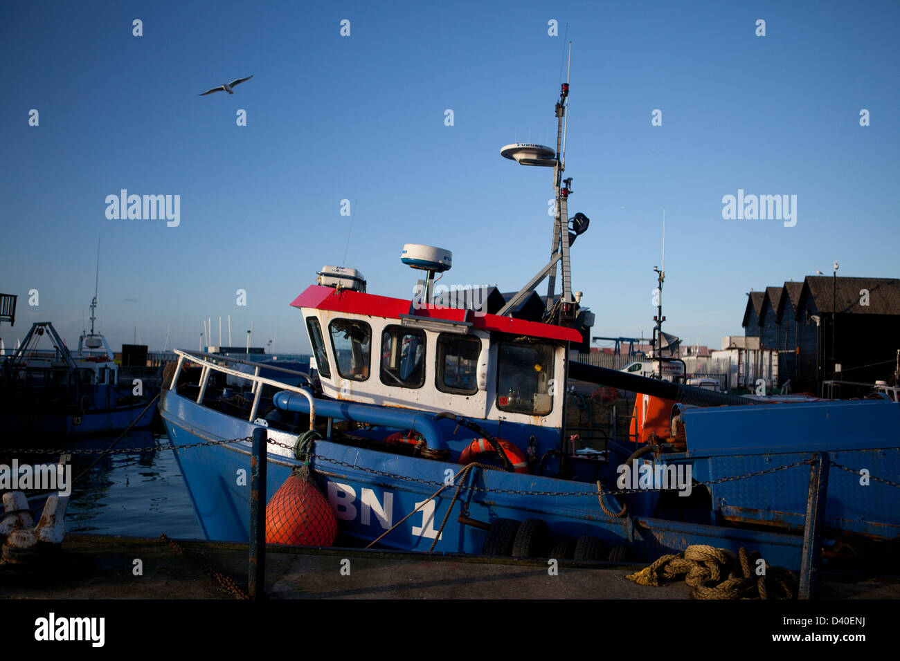 A fishing boat at the seaside town of Whitstable, Whitstable Harbour in Kent Stock Photo