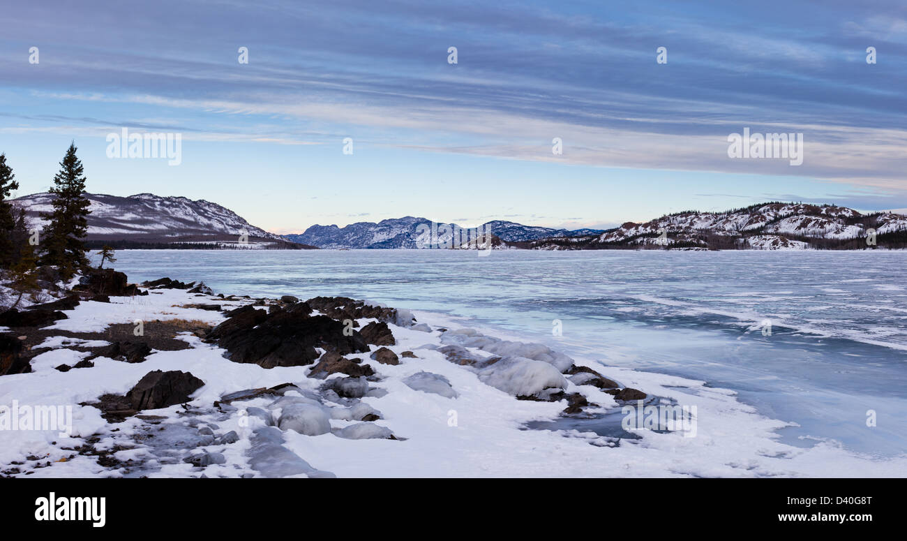 Hi-res panorama landscape of icy winter day at frozen Lake Laberge Yukon Territory Canada Stock Photo