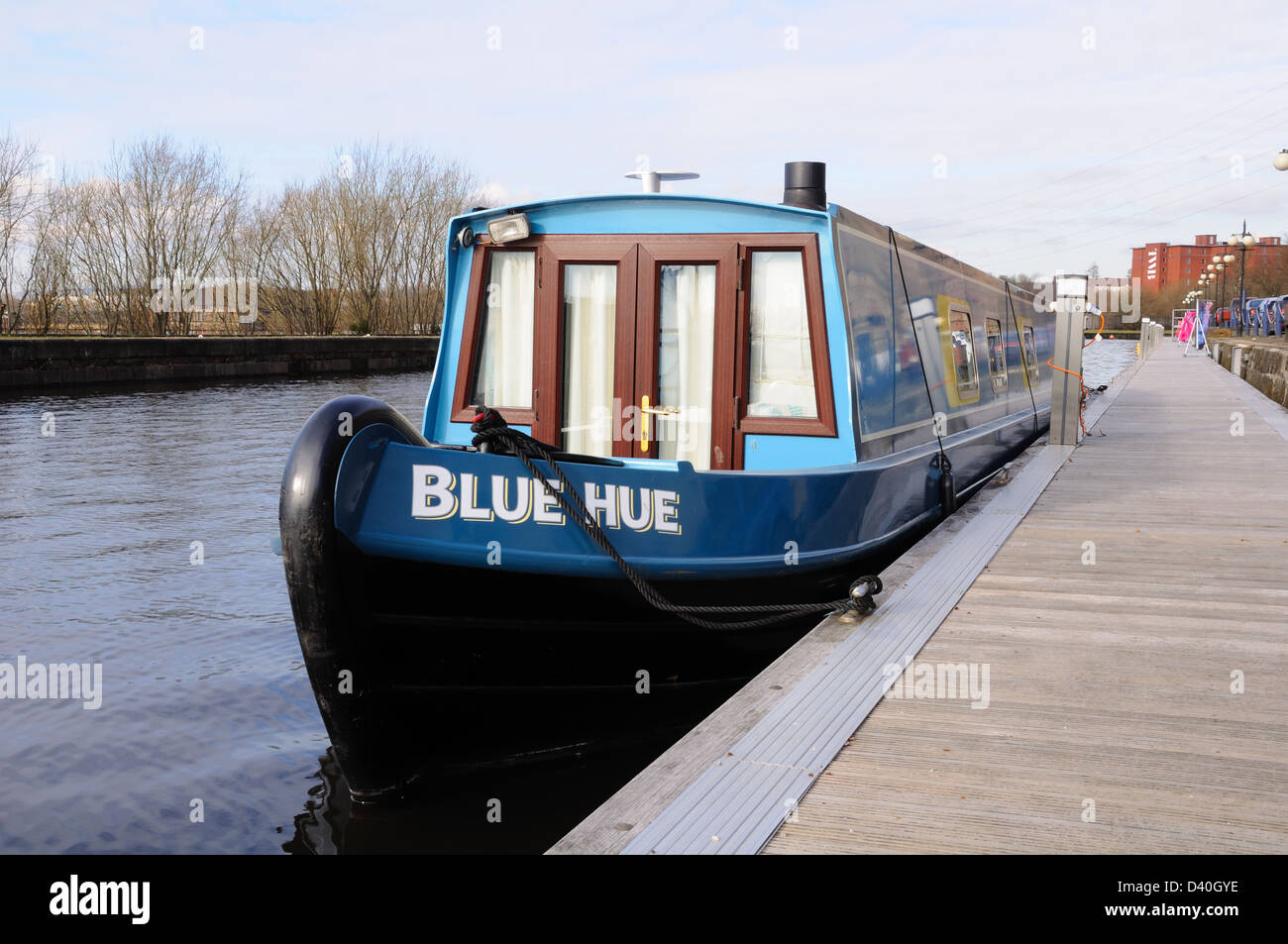 A boat moored on the Forth and Clyde Canal near the centre of Glasgow, Scotland, UK. Stock Photo