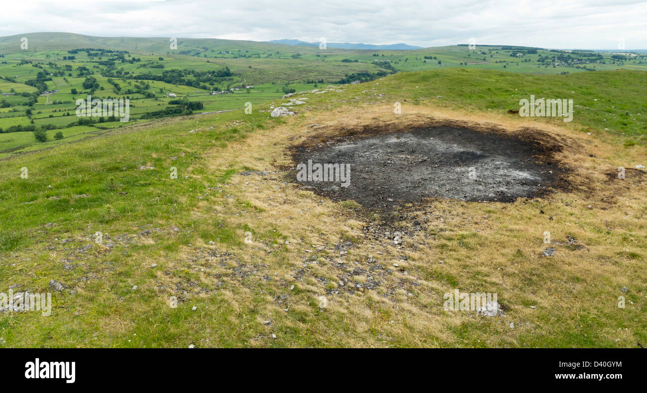Scorch mark left by Jubilee Bonfire on top of Knipe Scar, Bampton Cumbria Lake District England Stock Photo