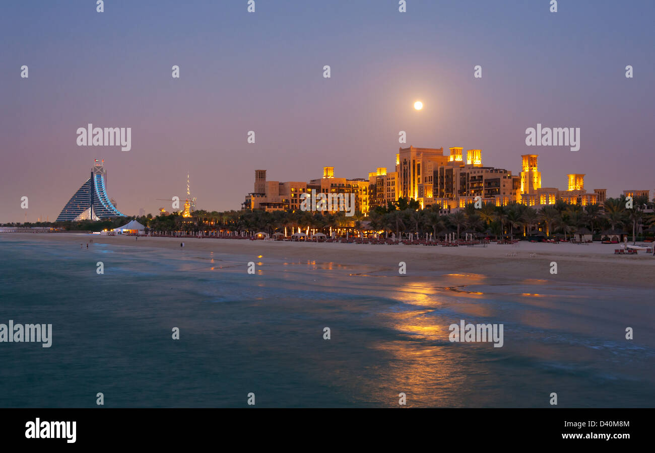 Luxurious hotel Madinat, Mina a Salam and Jumeriah Beach seen from the Jumeirah beach at night, Dubai - United Arab Emirates Stock Photo