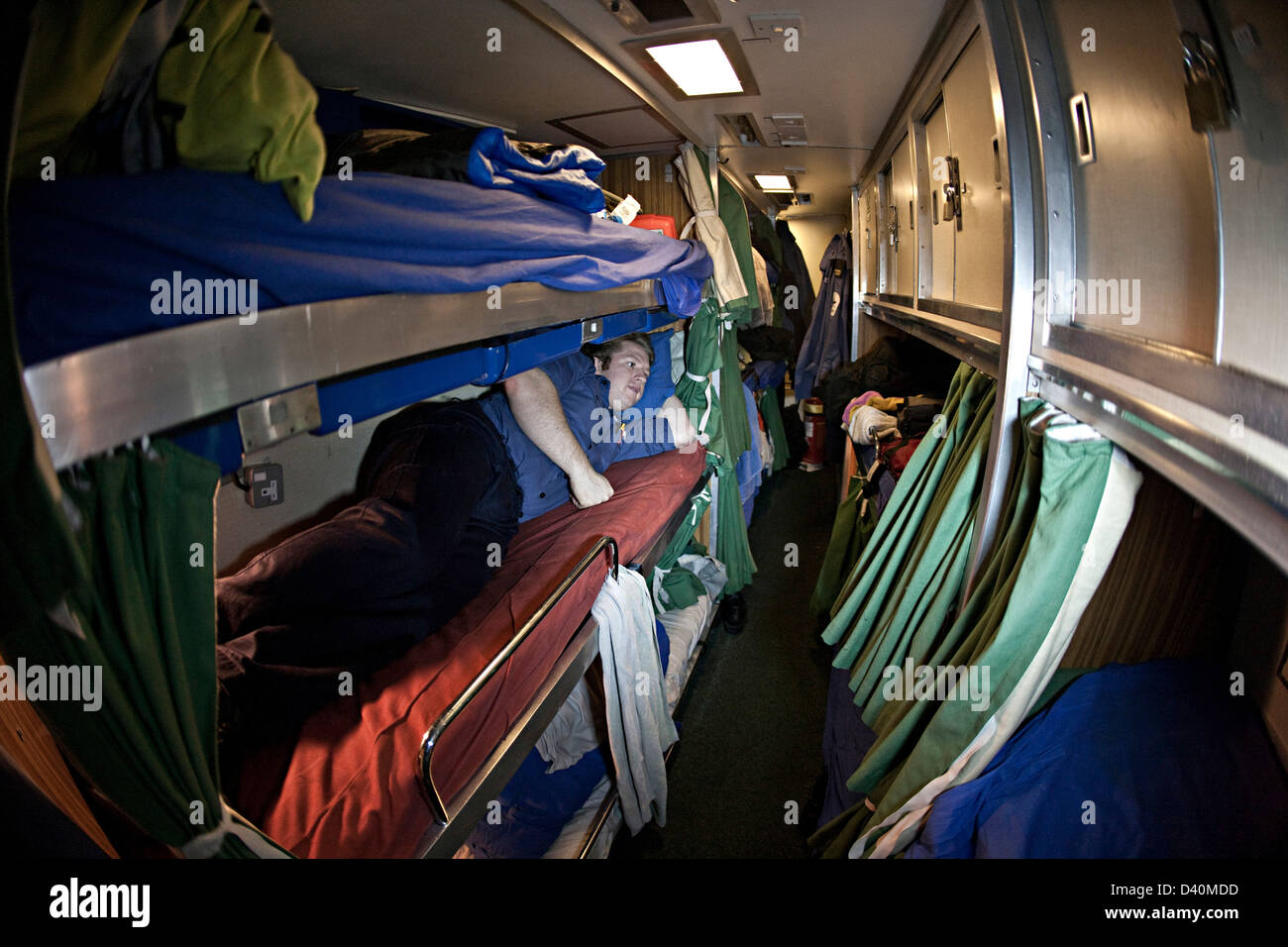Sailor in bunk room on Nuclear Submarine HMS Talent Stock Photo
