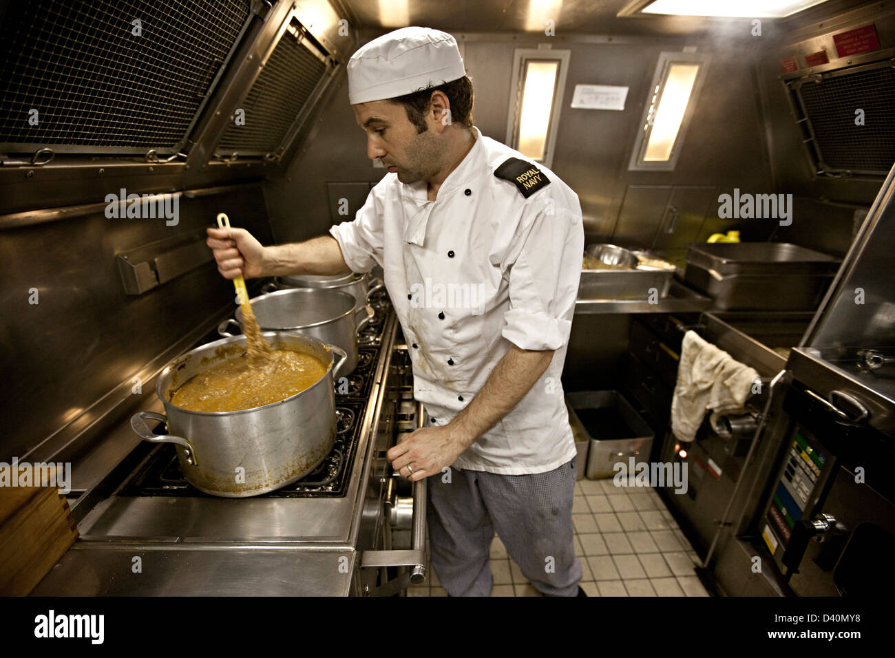 Chef working in kitchen of Nuclear Submarine HMS Talent Stock Photo