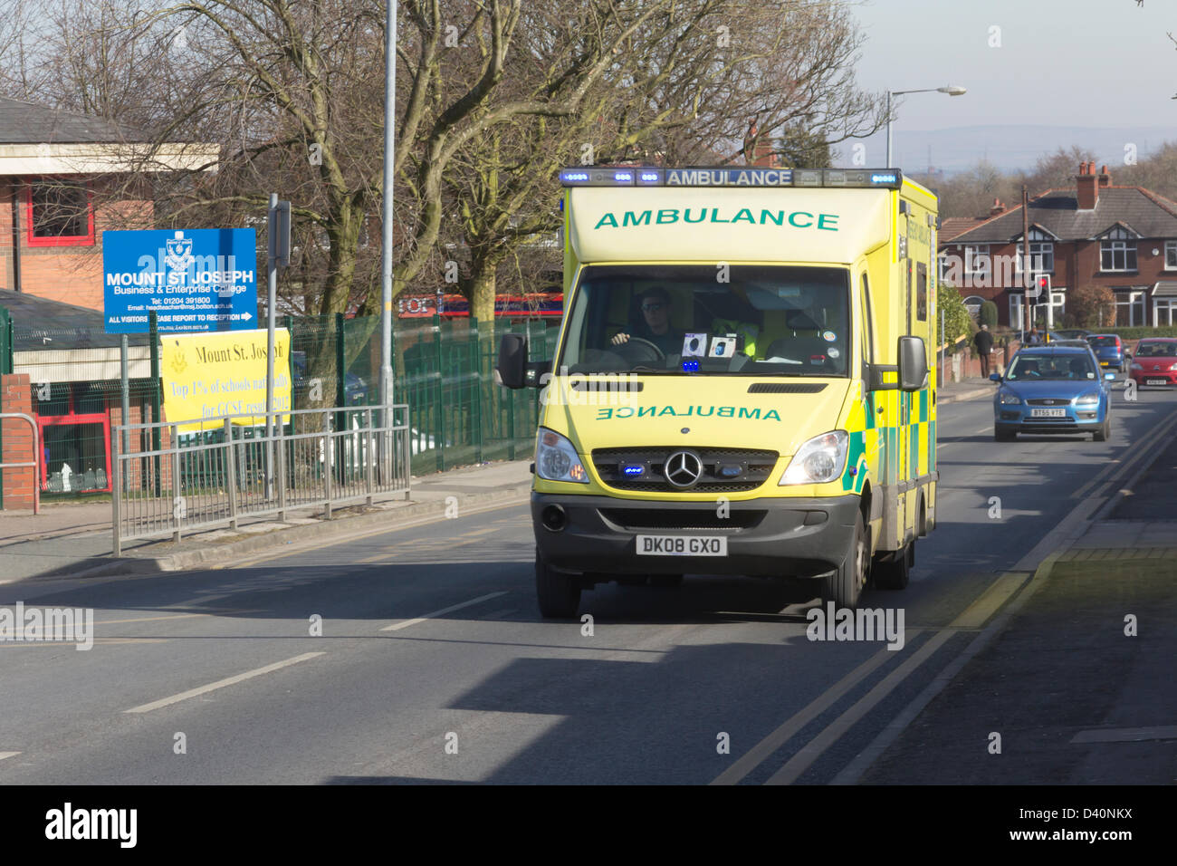 Royal Bolton Hospital,Lancashire. 28th February 2013. Ambulance  with blue flashing lights on Minerva Road approaching the Royal Bolton Hospital. Stock Photo