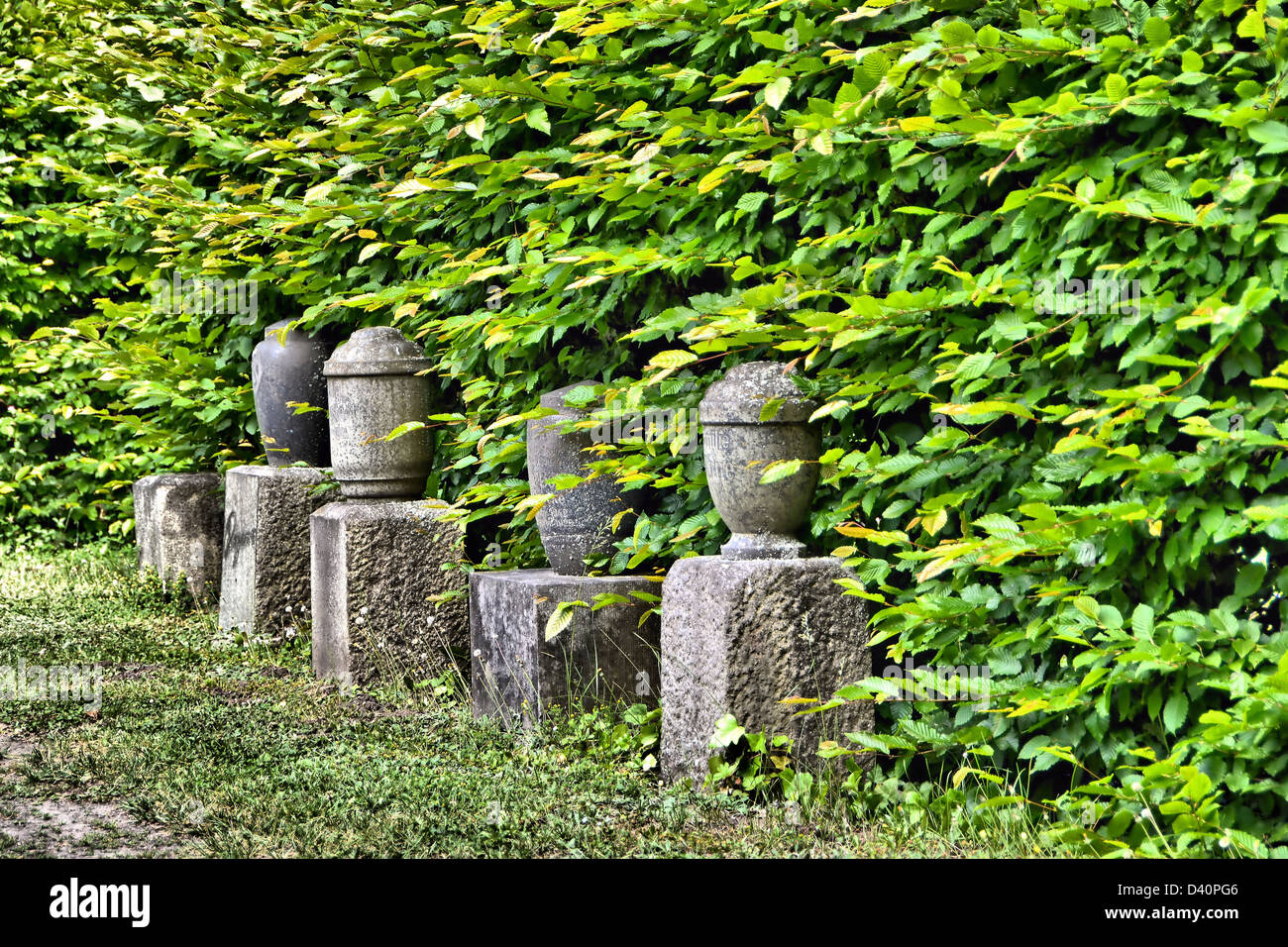 old urns in a cemetery Stock Photo Alamy