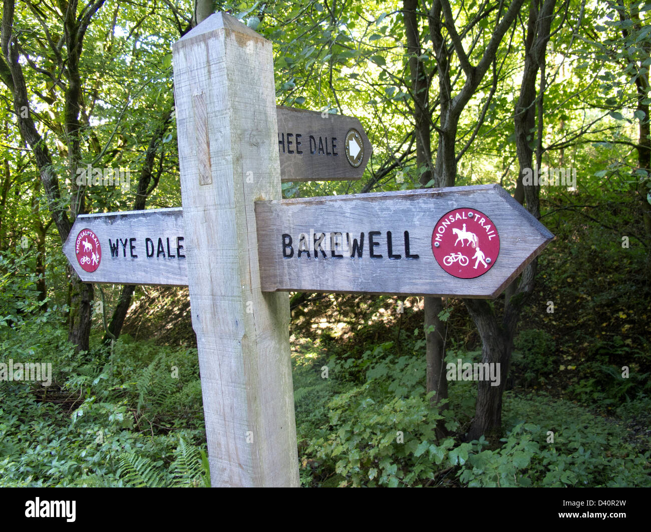 wooden sign post giving directions on monsal trail Stock Photo