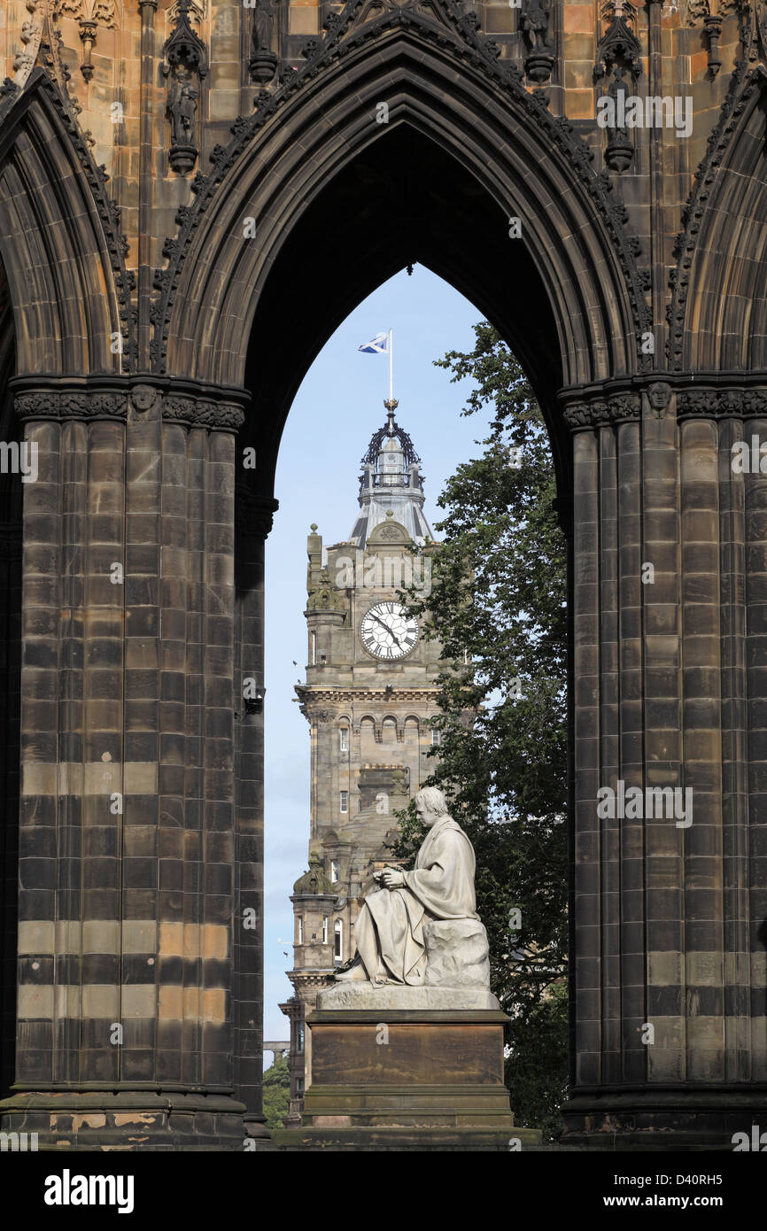 Sir Walter Scott Monument and Statue in East Princes Street Gardens, with the Balmoral Hotel Clock Tower behind, Edinburgh city centre, Scotland, UK Stock Photo