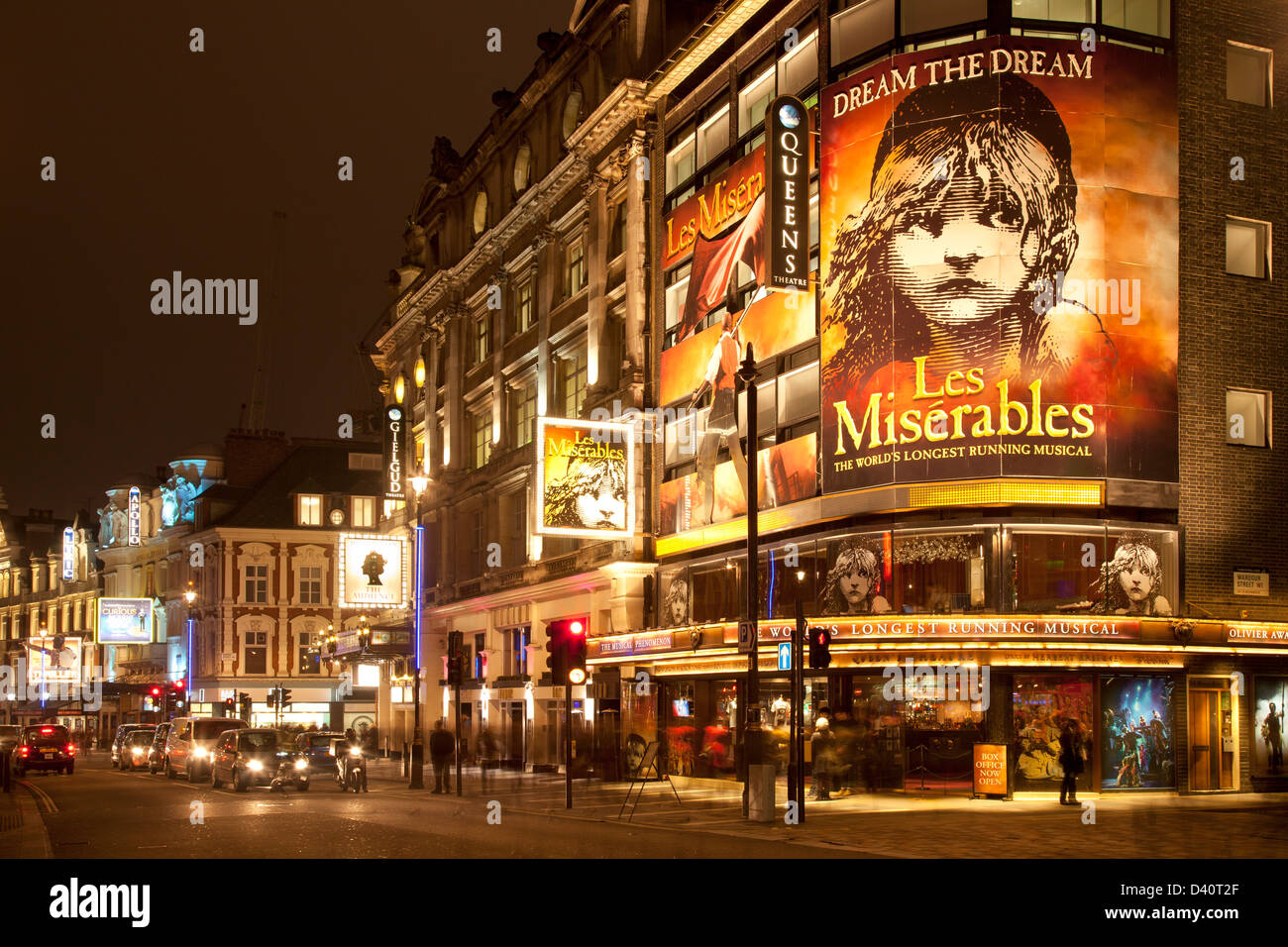 Heart of London theatreland, Shaftesbury Avenue: Queens Theatre with Les Miserables, Gielgud, Apollo and Lyric theatres at night Stock Photo