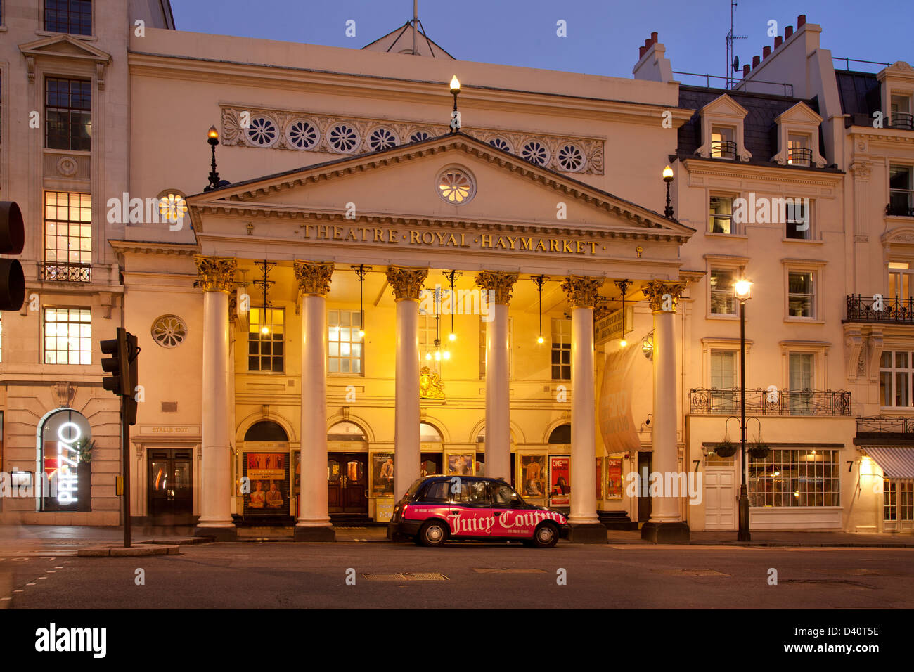 London, Theatre Royal, Haymarket at dusk, with taxi Stock Photo