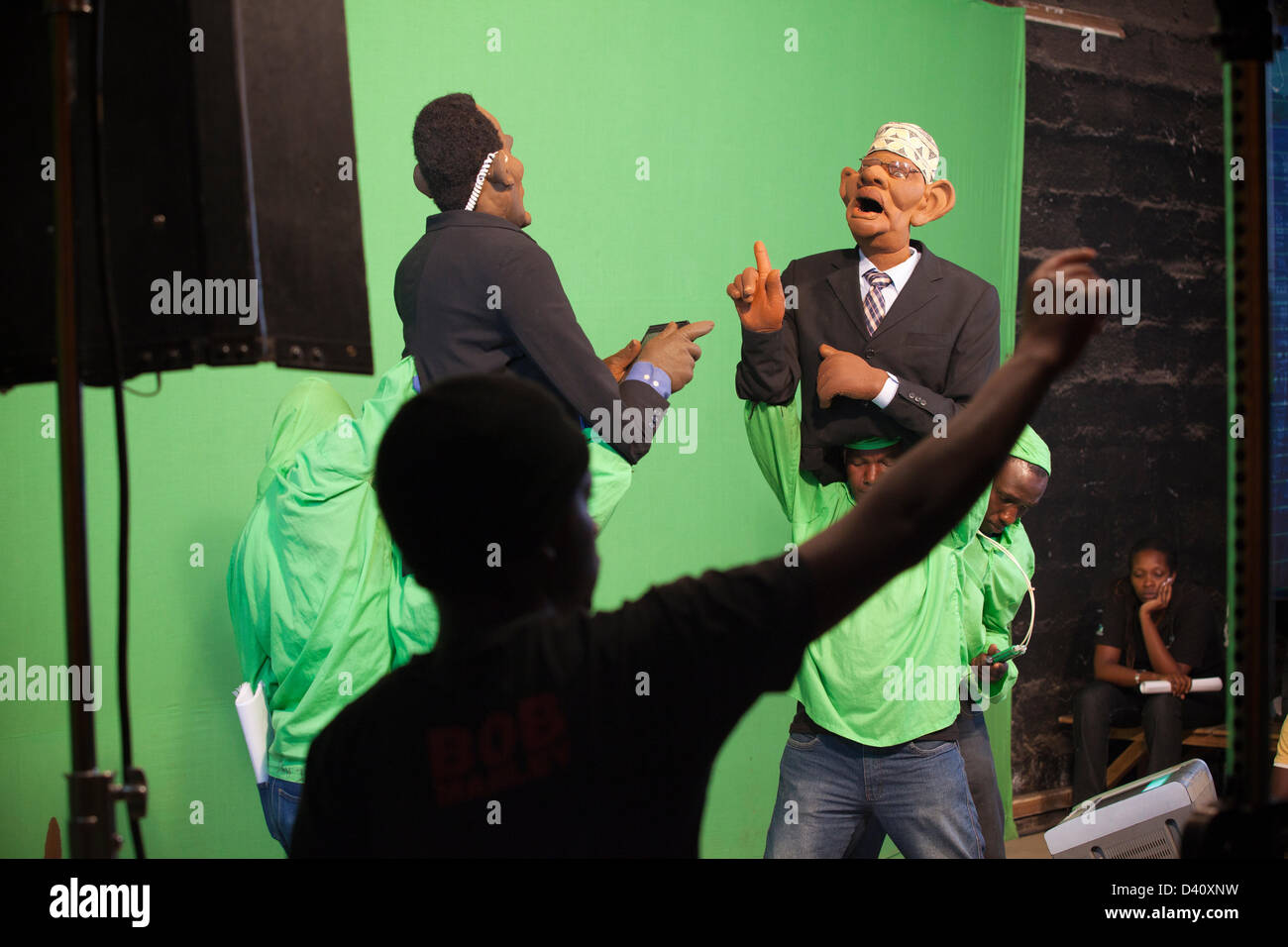 Nairobi, Kenya. 26th Feb 2013. Behind the scenes of Kenya's political satire 'The XYZ Show' puppeteers film the 2013 election special against a green screen. (The puppet on the left called 'Keff Joinange' is a spoof of the Kenyan journalist and news anchorman Jeff Koinange and is interviewing 'Isaac Hassan' of the International Electoral Boundaries Commission (IEBC)). Stock Photo