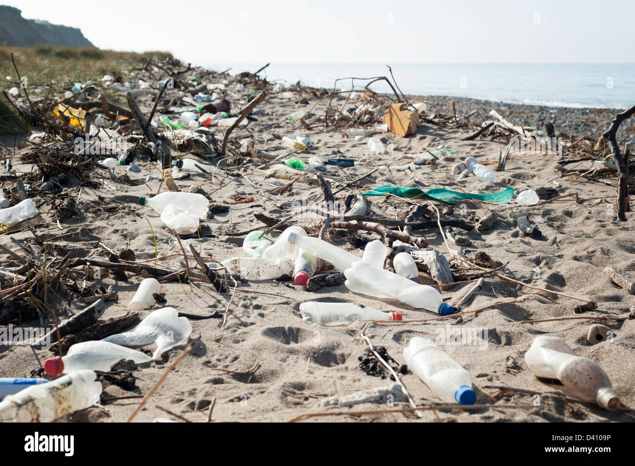 Plastic bottles and other rubbish and waste washed up on a dirty British beach Stock Photo