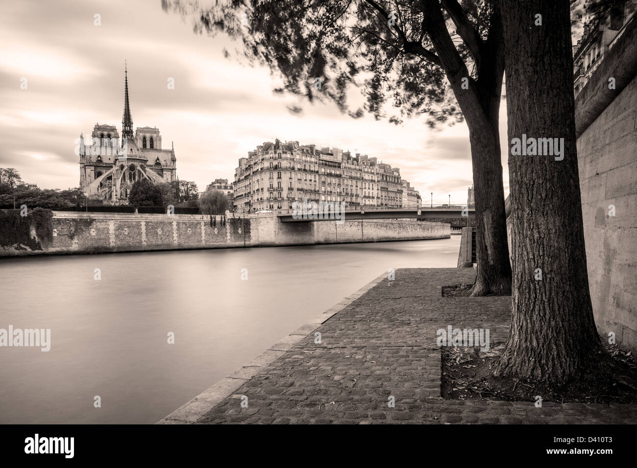 Walkway along River Seine and Cathedral Notre Dame, Paris, Ile-de-France, France Stock Photo
