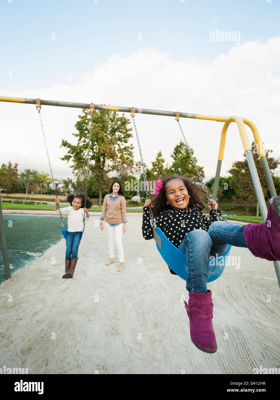 Family playing on swing set hires stock photography and images Alamy