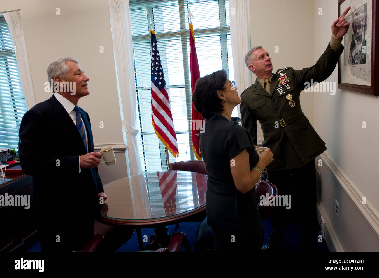 US Secretary of Defense Chuck Hagel and his wife Lilibet are given a tour by his senior military advisor, Marine Corps Lt. Gen. Thomas Waldhauser as the new Secretary February 27, 2013 in Arlington, Virginia. Stock Photo