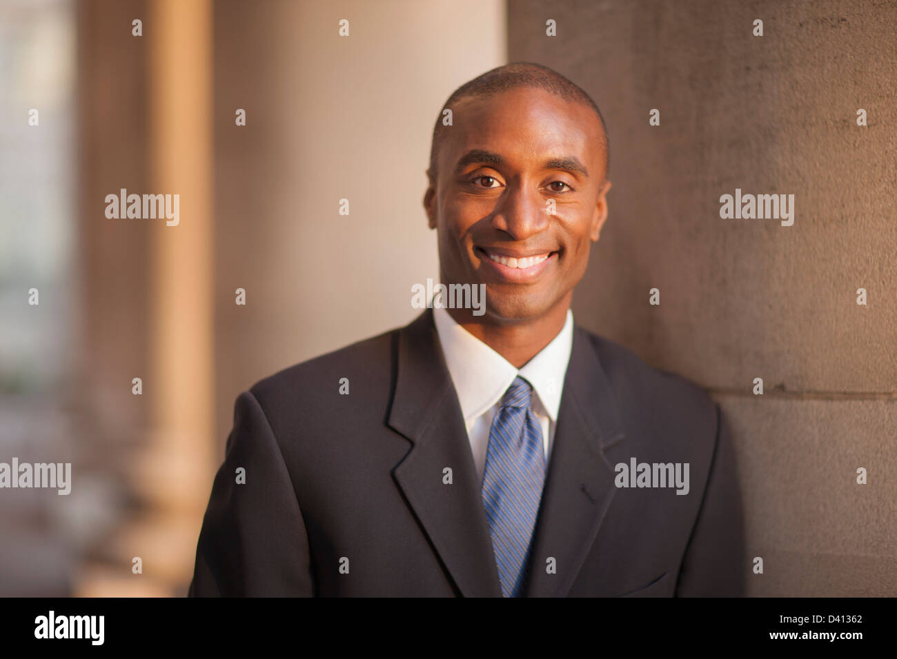 Black businessman smiling Stock Photo - Alamy