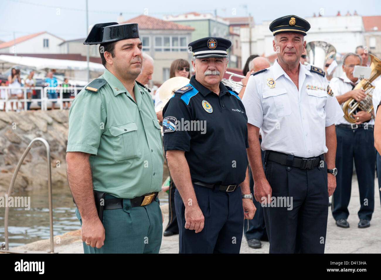 Police and Guardia Civil attending ceremony to honour local fishermen lost at sea, Corrubedo, Rias Baixas, Galicia, Spain Stock Photo