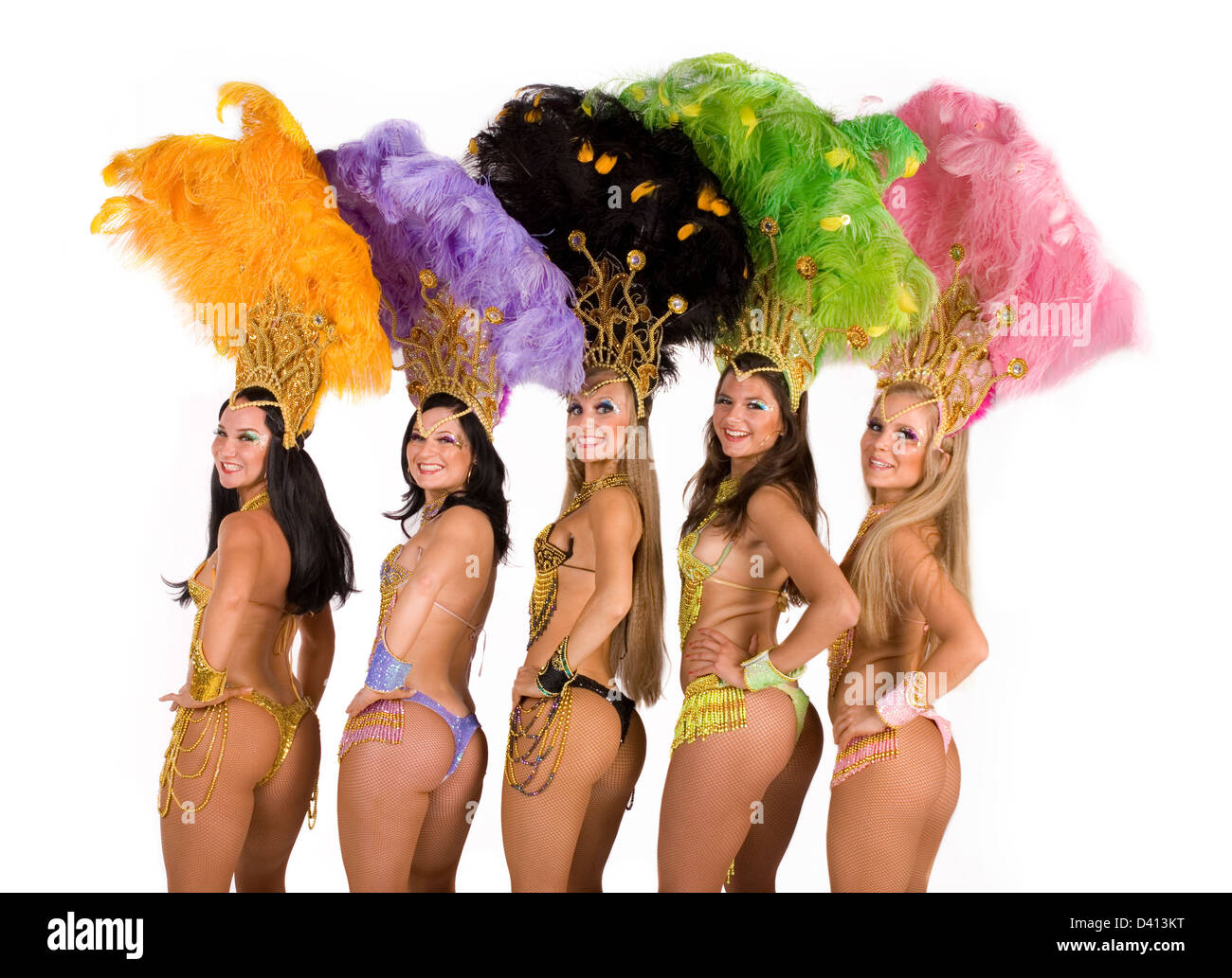 Portrait of five young women in carnival costumes against white background Stock Photo
