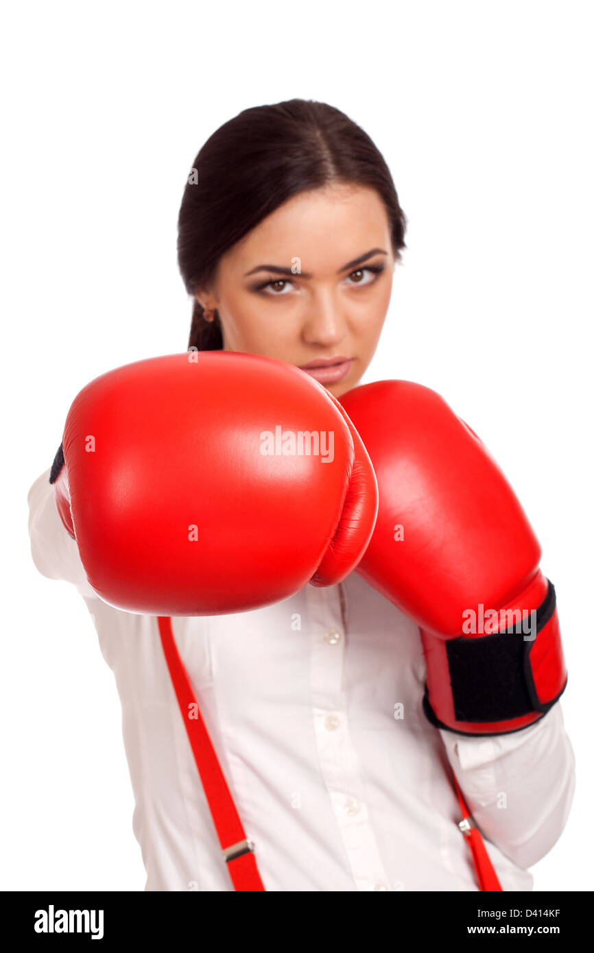 Portrait of business woman wearing boxing gloves Stock Photo