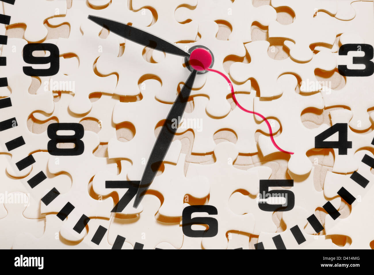 Clock and Jigsaw Puzzle Pieces Stock Photo