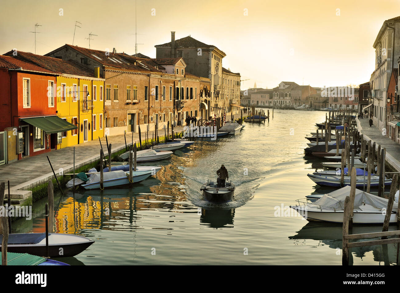 Evening canal in Murano with boats, island near Venice, Italy Stock Photo