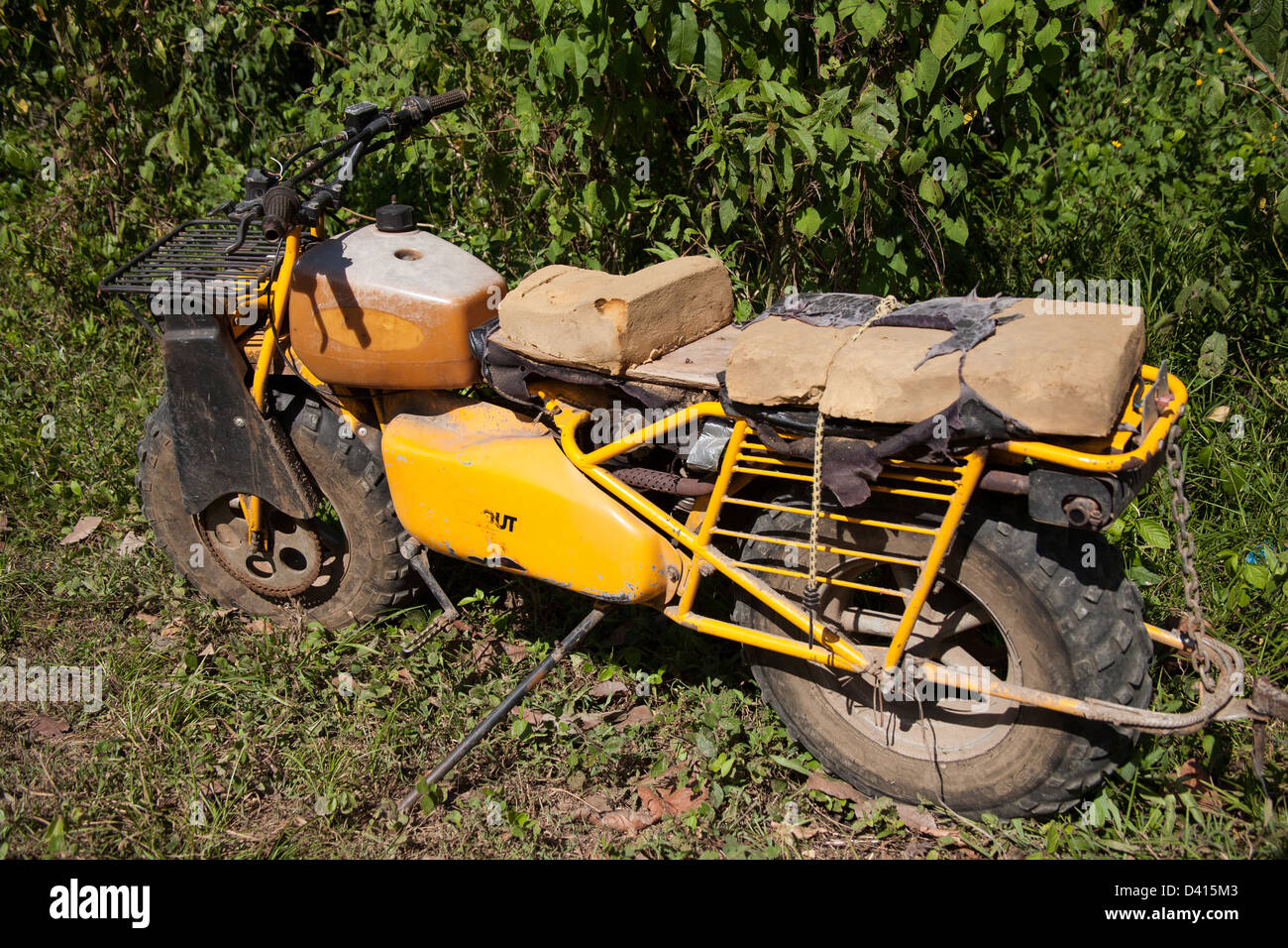 Old, used and small motorcycle with knobby tires. Stock Photo