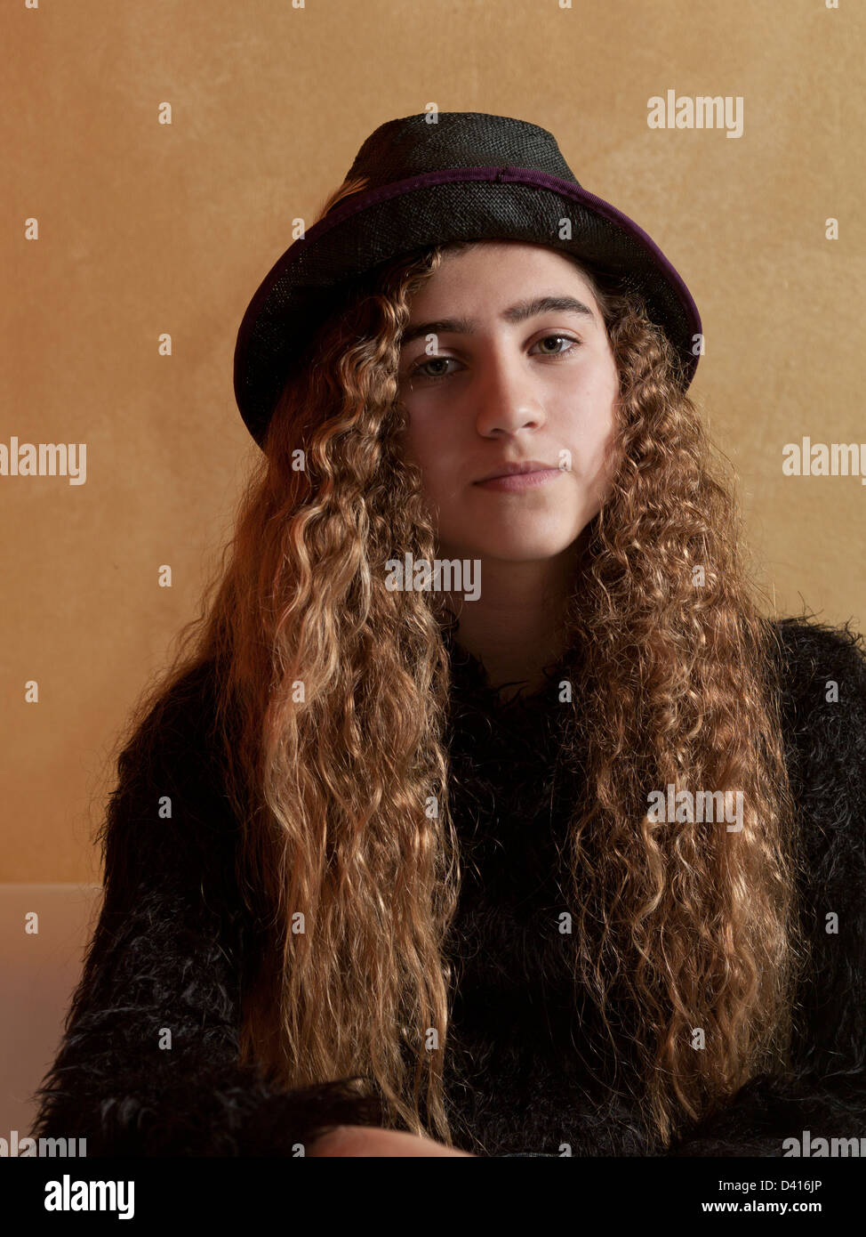 Portrait of a Young Girl with Long Curly Hair Stock Photo - Alamy