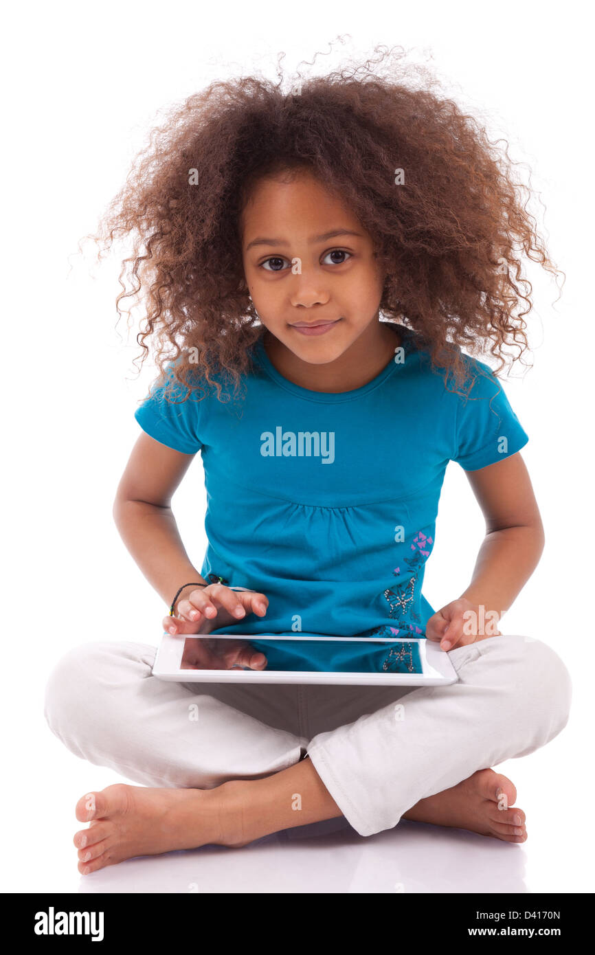 Little african asian girl using a tablet pc, isolated on white ...