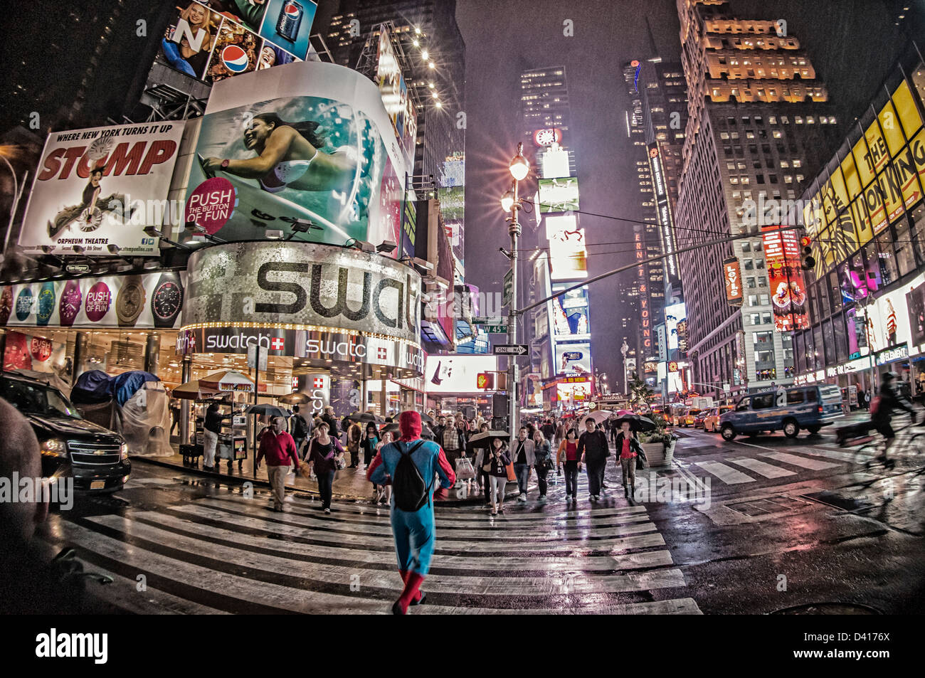Spider Man at Times Square at twilight on a rainy day in New York  Stock Photo