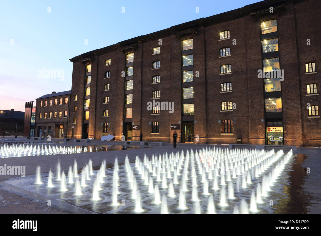 The water fountains in front of Central St Martin's School of Art, in Granary Square, on the King's Cross Estate, London NC1, UK Stock Photo