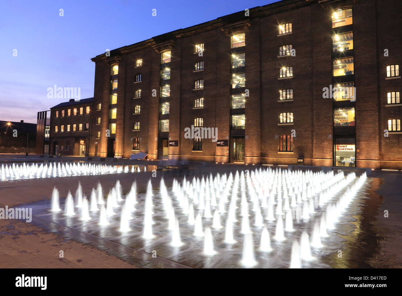 The water fountains in front of Central St Martin's School of Art, in Granary Square, on the King's Cross Estate, London NC1, UK Stock Photo