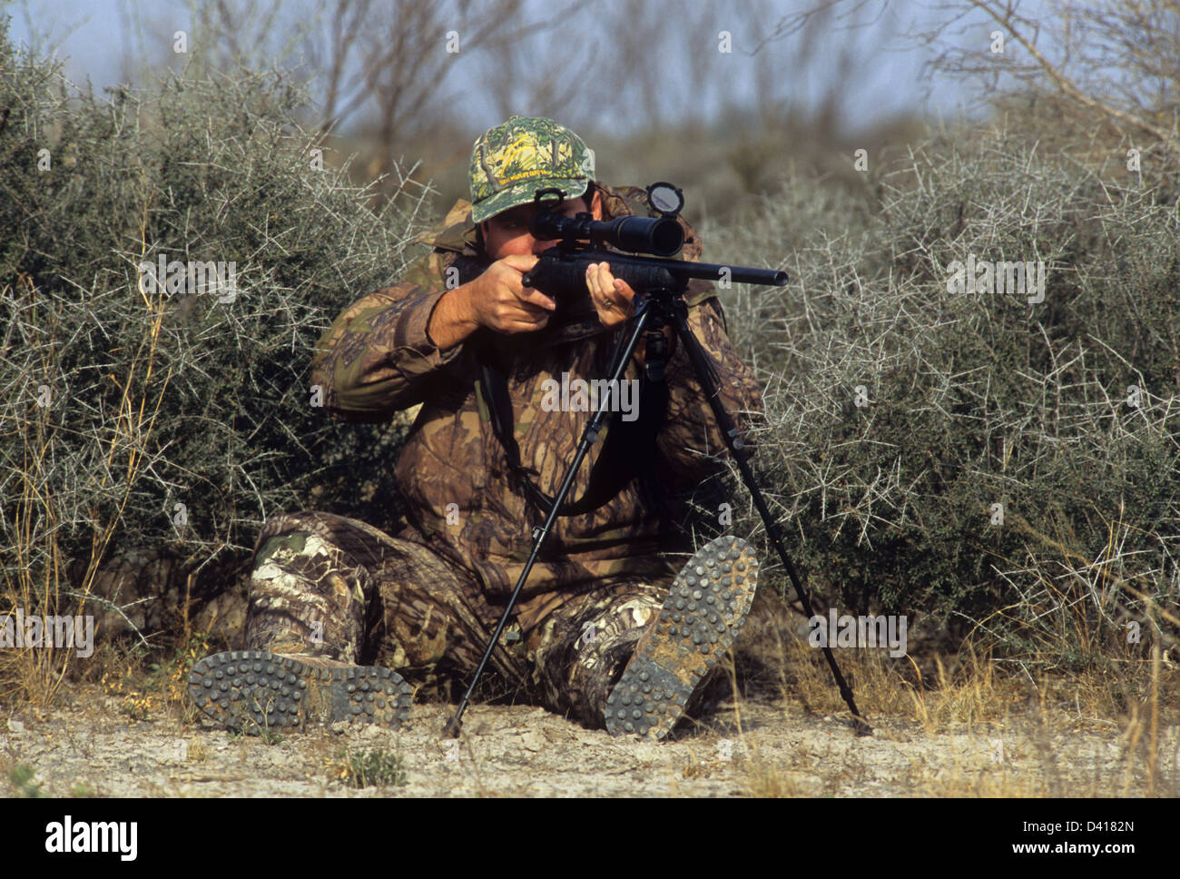 camouflaged sniper rifle with scope Stock Photo - Alamy