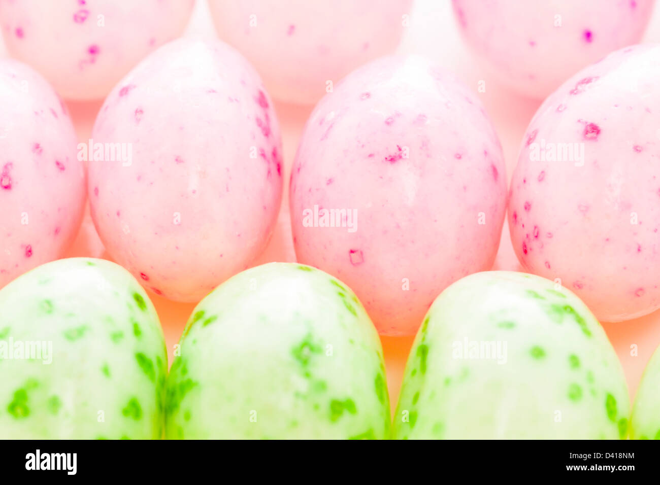 Assorted jelly beans in pastel colors with darker spots Stock Photo Alamy