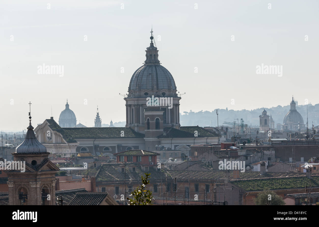 Basilica church of San Carlo al Corso in the skyline of Rome Italy with smog in the distance Stock Photo