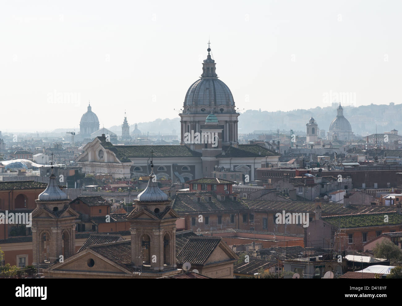 Basilica church of San Carlo al Corso in the skyline of Rome Italy with smog in the distance Stock Photo