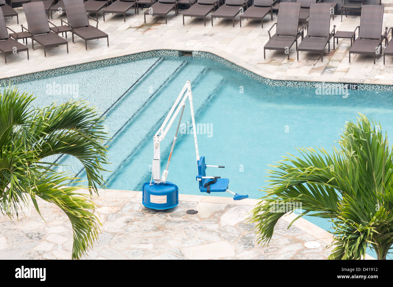 Disabled person pool lift meets ADA standards installed by swimming