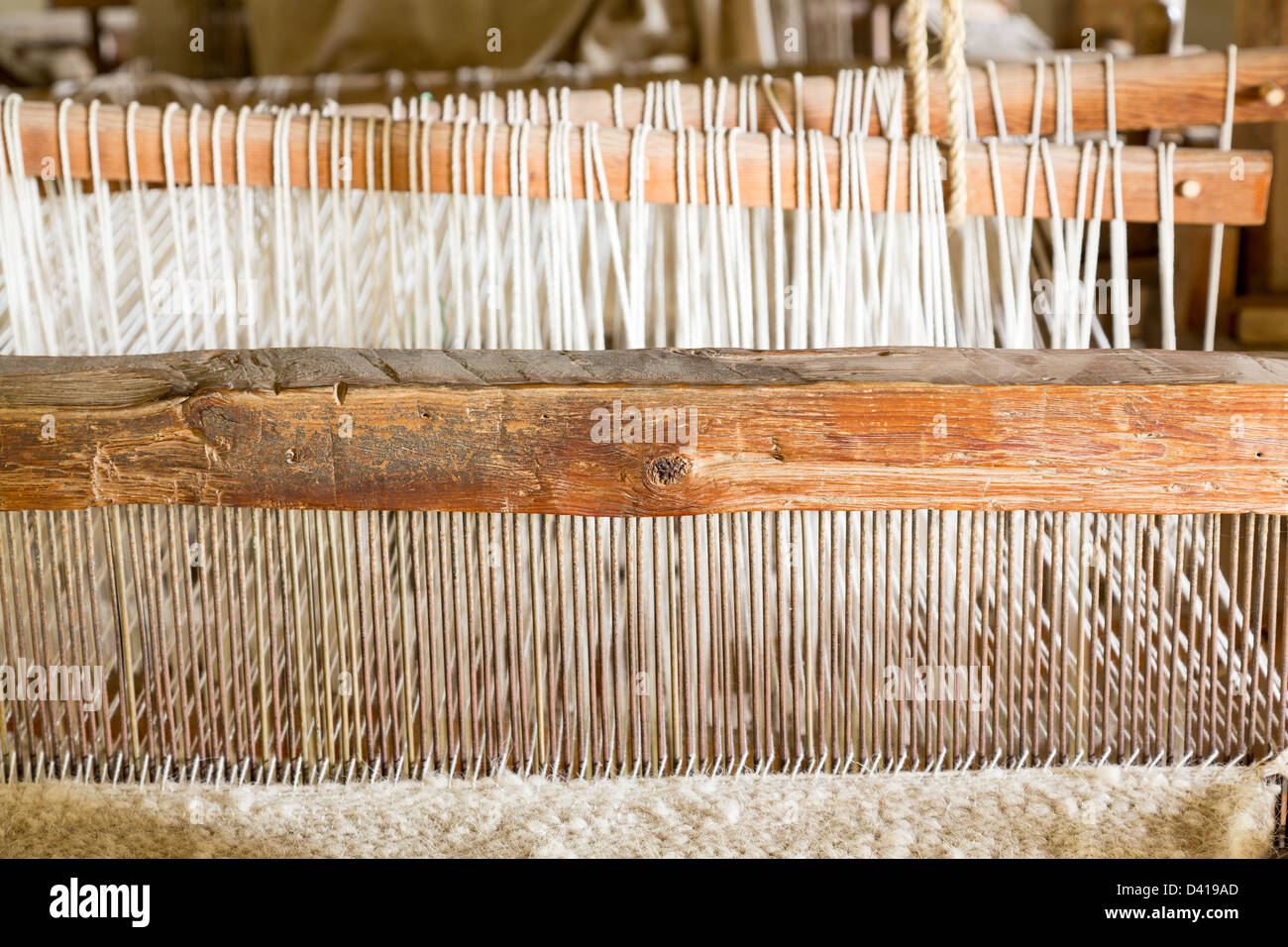 Old weaving loom made from timber making cloth in La Purisima mission California Stock Photo