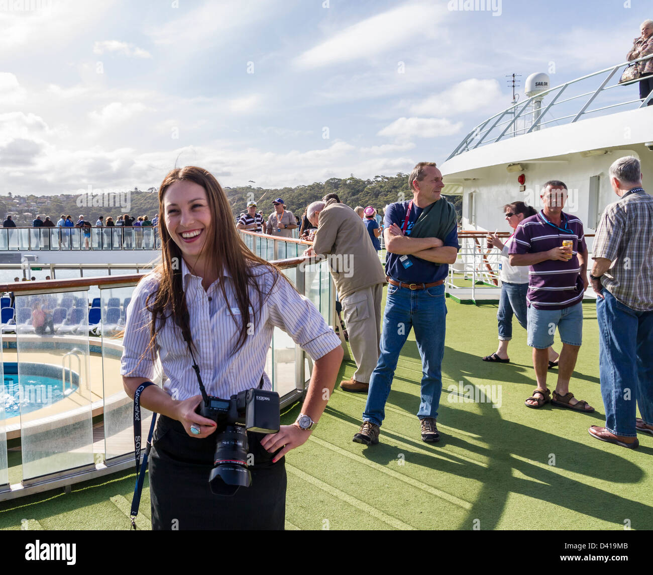 smiling cruise ship photographer on po pacific pearl taking pictures of passengers of departure from sydney - Cruise Ship Photographer smiling cruise ship photographer on po pacific pearl taking pictures of passengers of departure from sydney - Cruise Ship Photographer