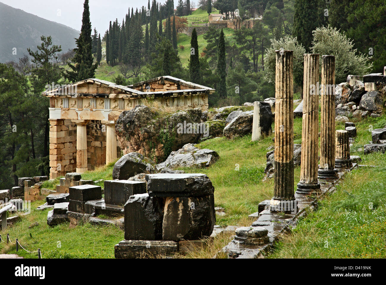 The Treasury of the Athenians at  ancient Delphi, the 'navel'  of the ancient world, Fokida, Central Greece. Stock Photo