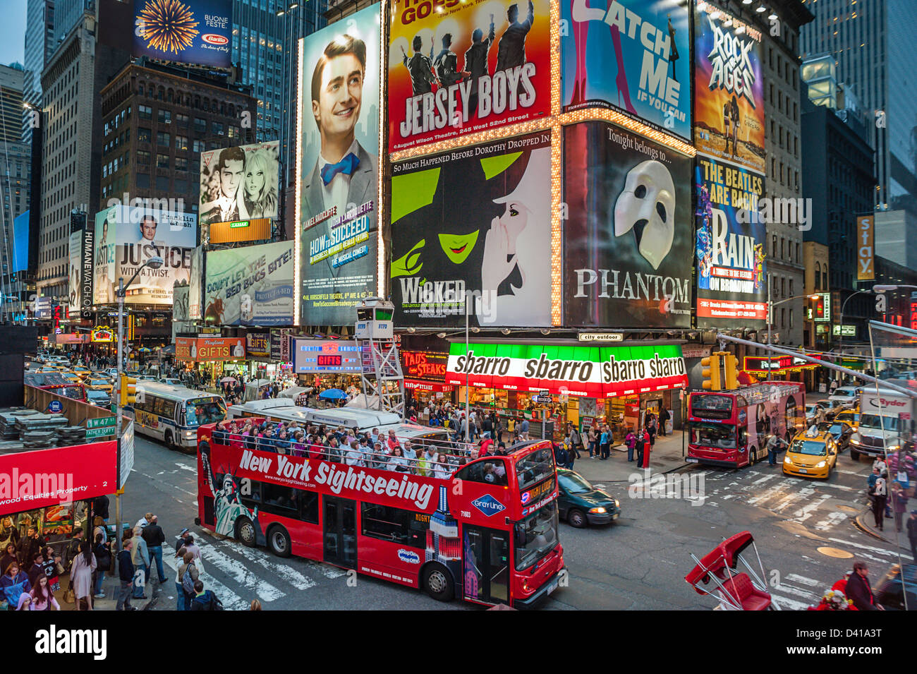 A sightseeing bus packed with tourists in Times Square New York City