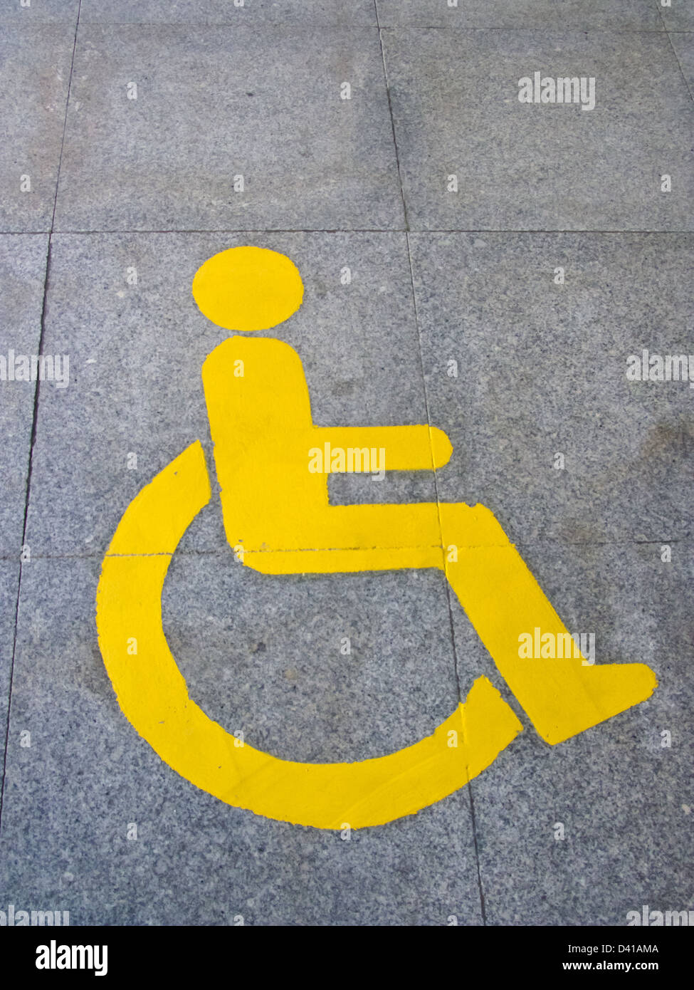 Yellow handicapped sign of floor tile Stock Photo