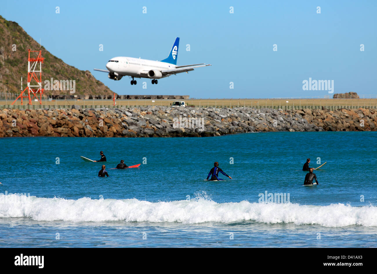 Surfing at Lyall Bay next to Wellington Airport Stock Photo Alamy