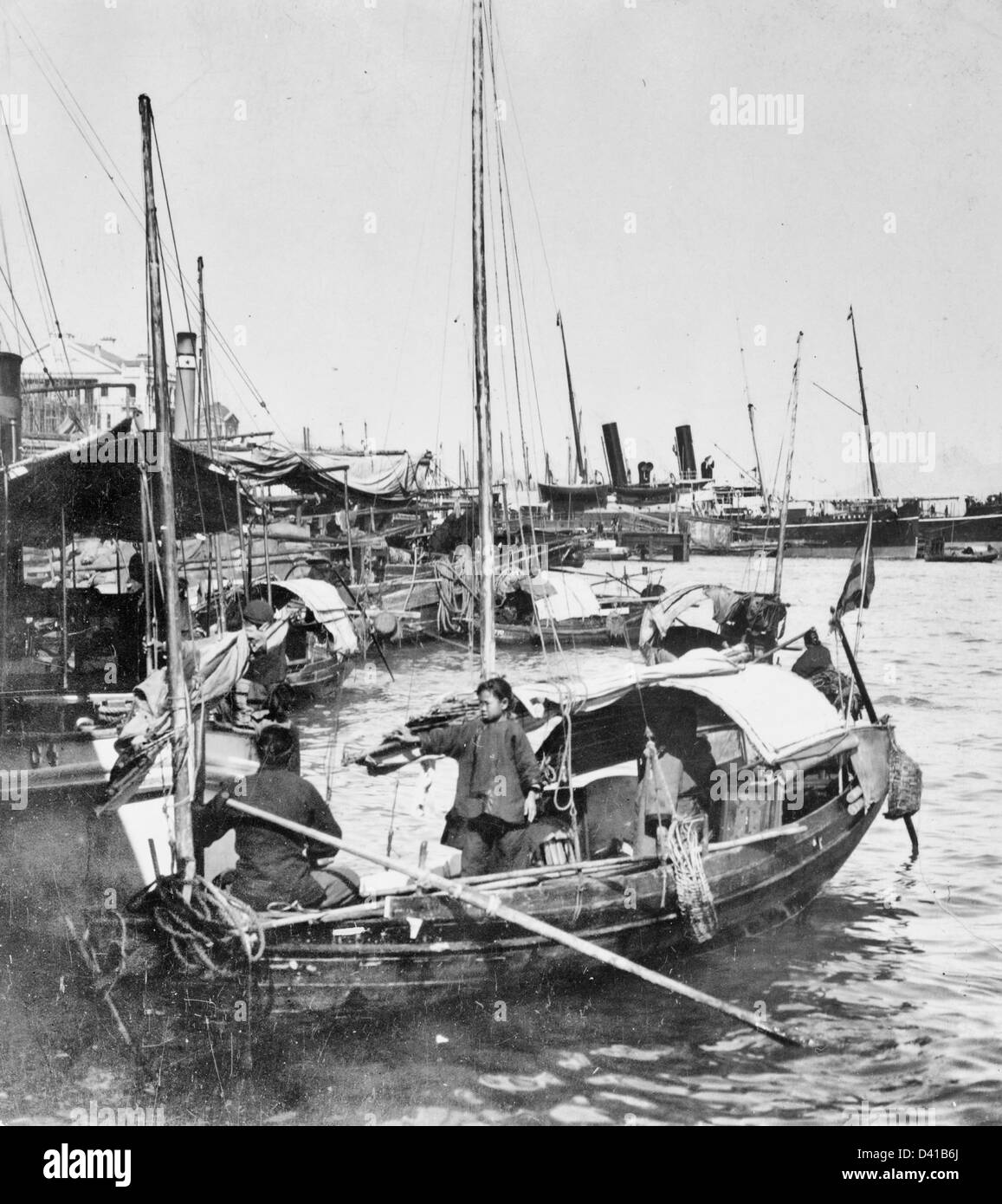 Opium trader, Hong Kong harbor, greatest opium port in the world, China, circa 1901 Stock Photo
