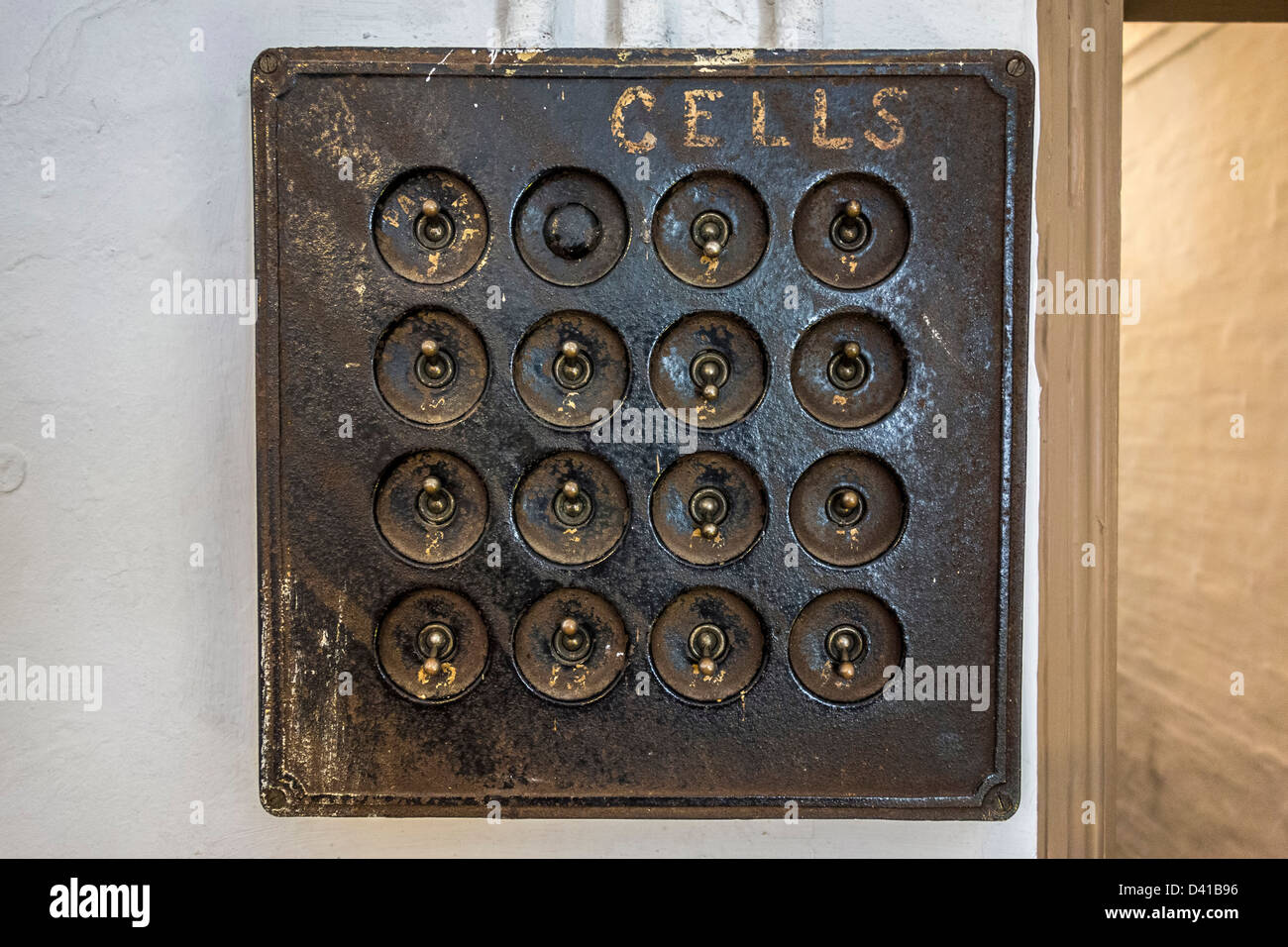 Prison cells light switch. Stock Photo