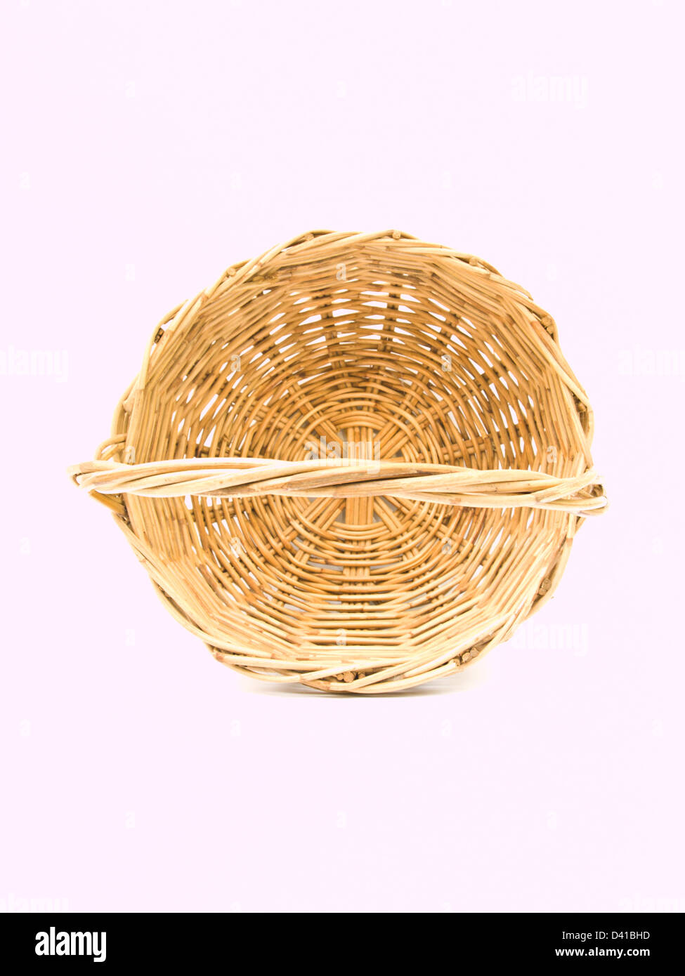 Rattan wicker basket isolated on white Stock Photo - Alamy