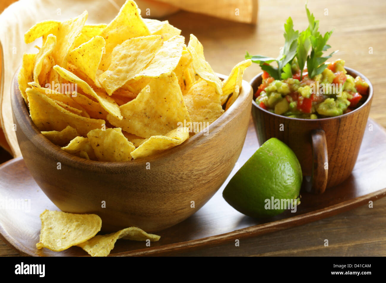 corn tortilla chips in a wooden bowl Stock Photo