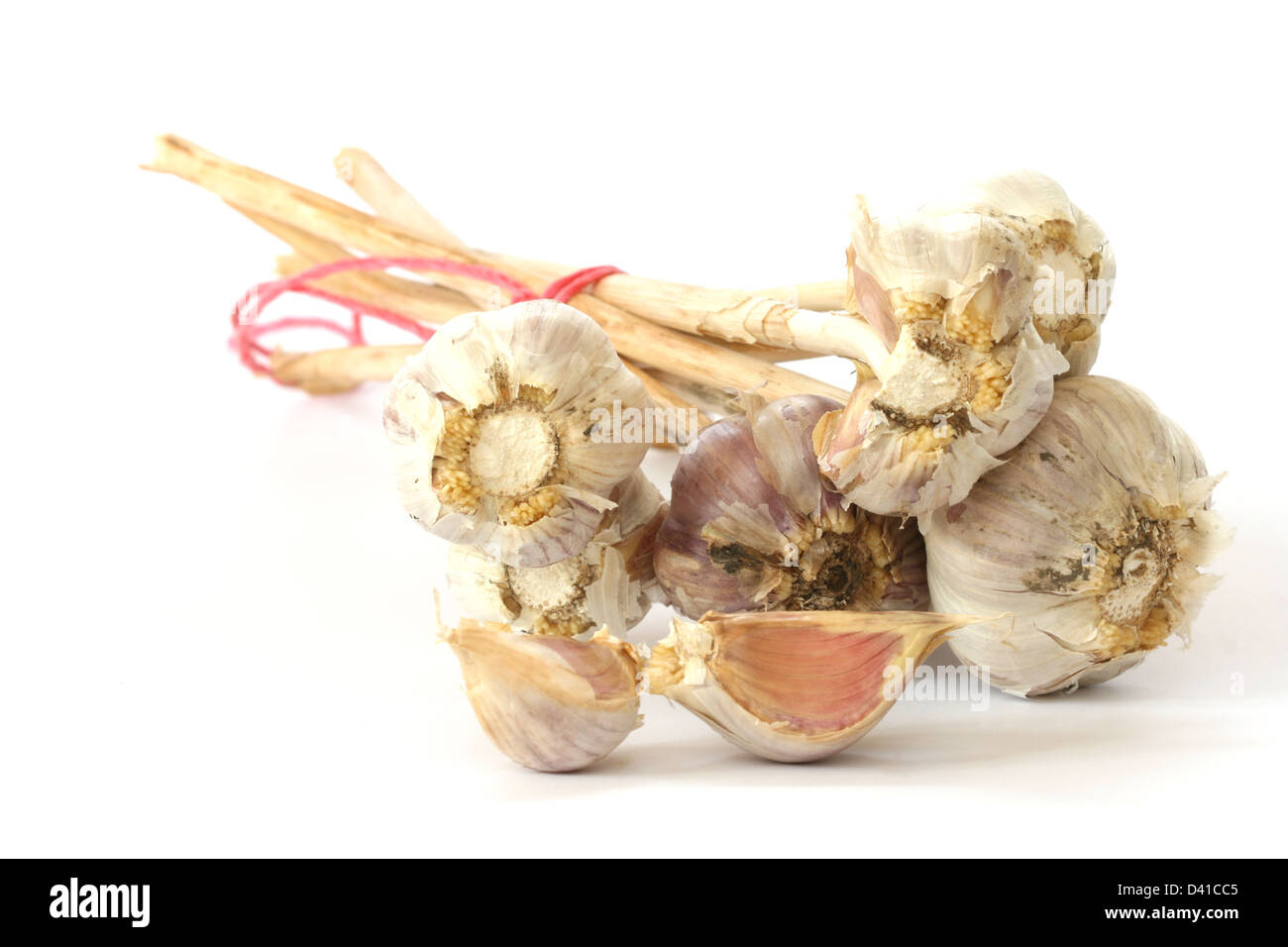 Few garlic heads and cloves on white background Stock Photo Alamy