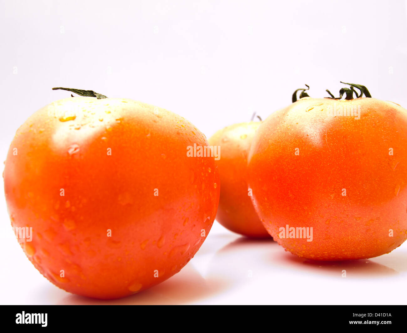 Fresh tomatoes isolated on white background Stock Photo