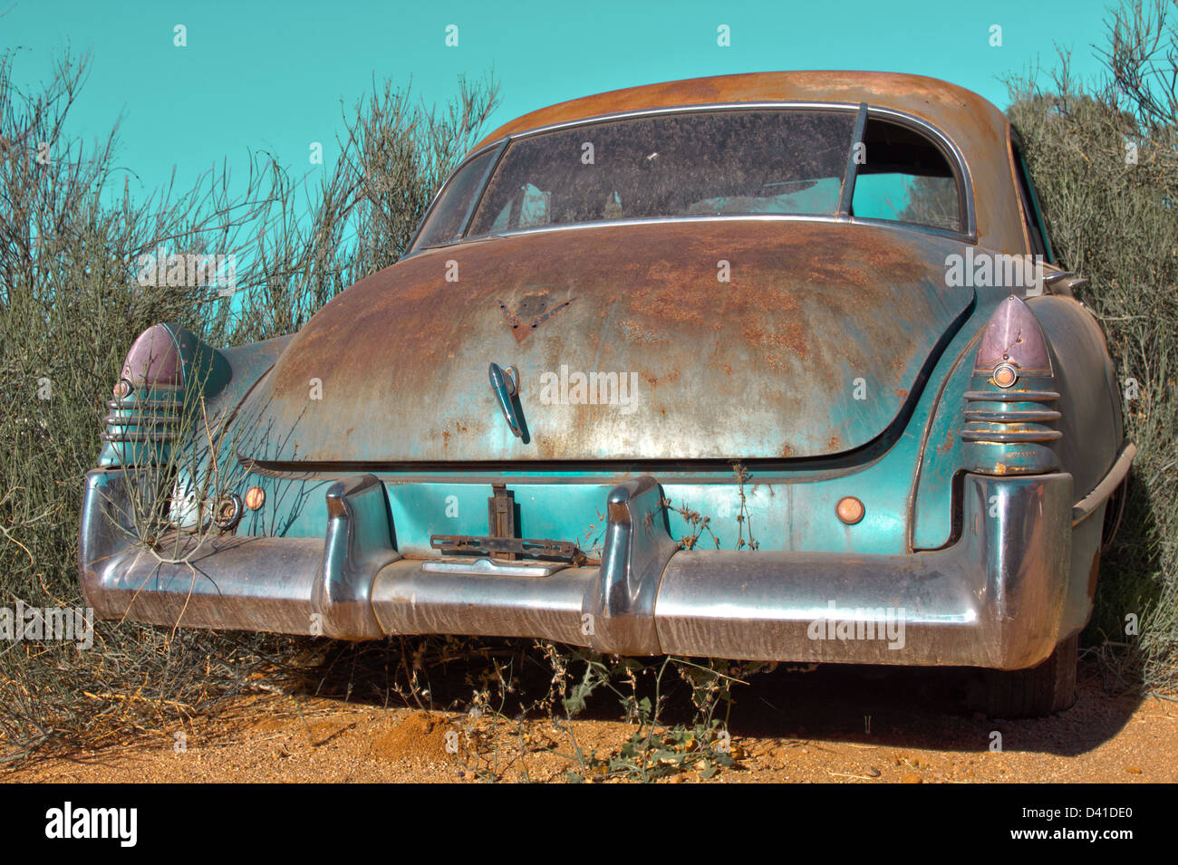 Oldtimer car standing in the shrub Stock Photo